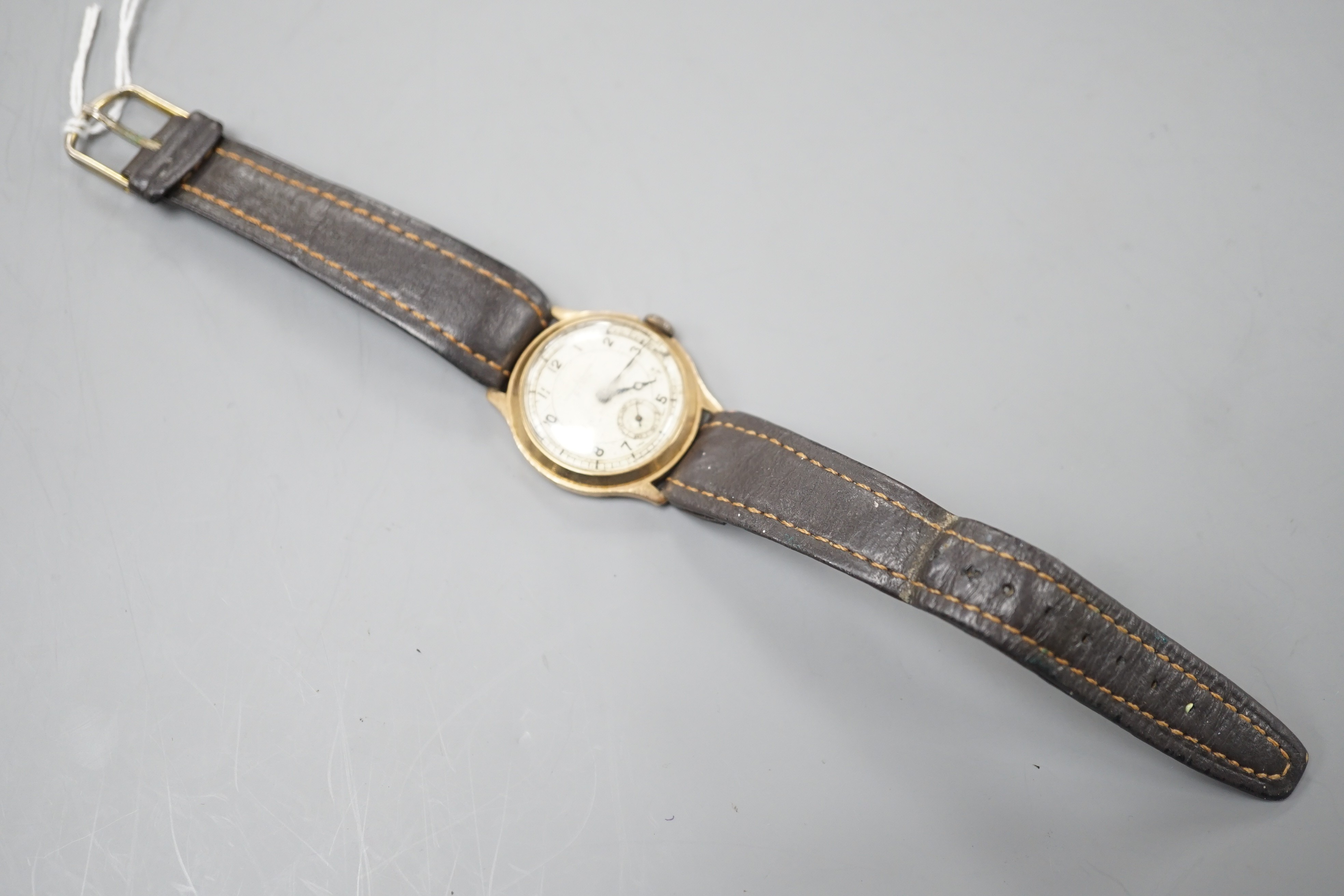 A gentleman's mid 20th century 9ct gold Cyma manual wind wrist watch, retailed by Collingwood, on associated? leather strap, case diameter 28mm.